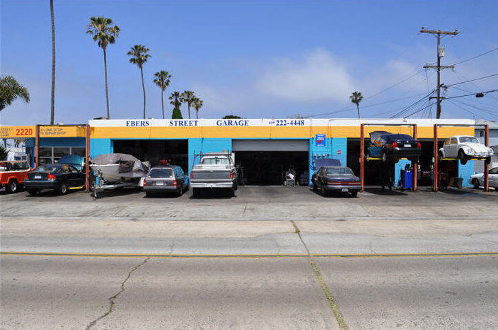 The real Ebers Street Garage storefront with palm trees at 2220 Ebers Street